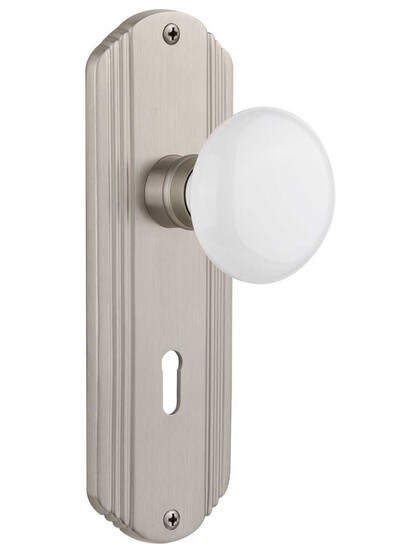 Streamline Moderne Mortise Lock Set With White Porcelain Door Knobs in Satin Nickel.